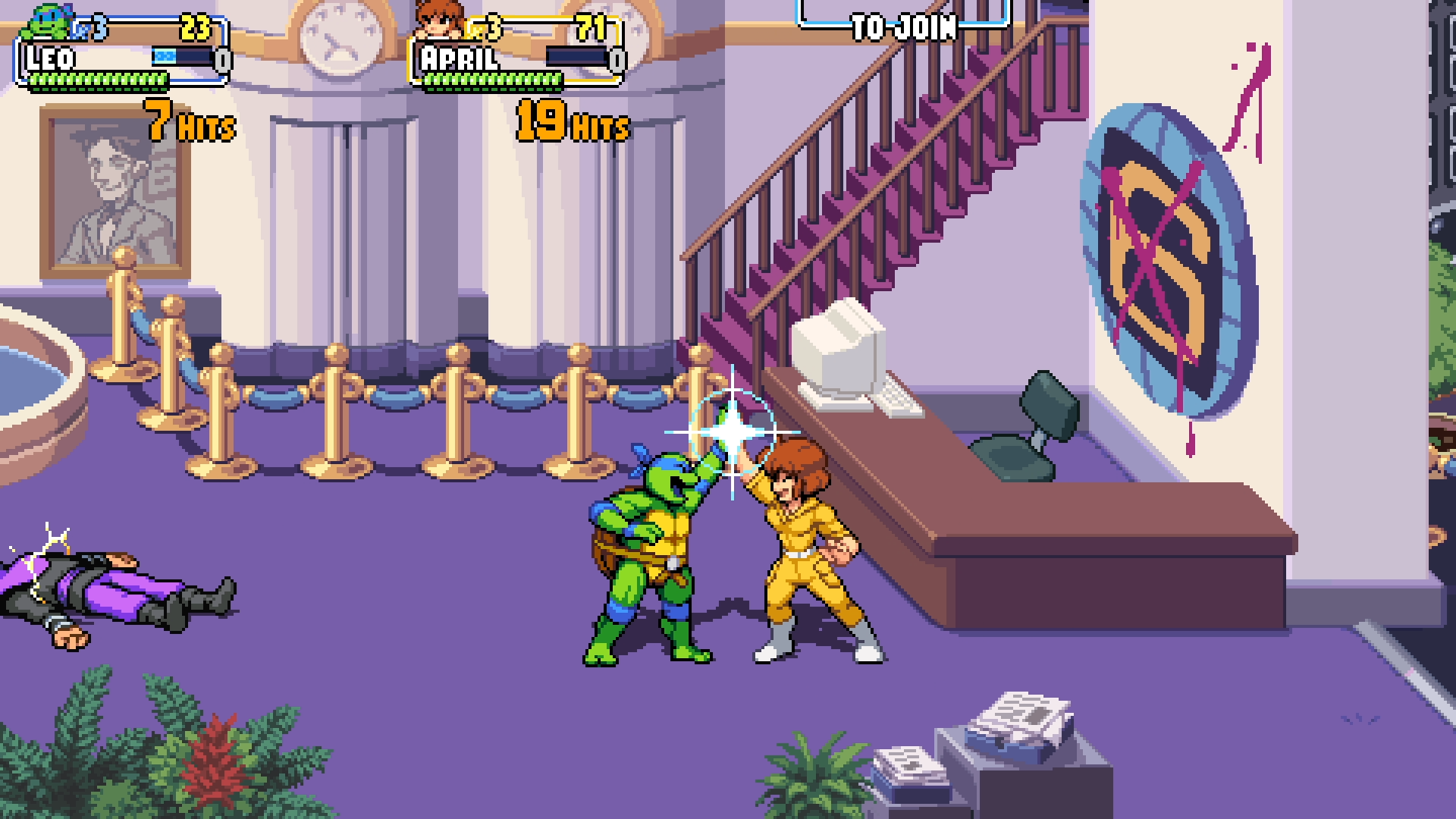 Leonardo and April exchange a high five in a lobby in Shredder's Revenge